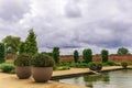 Walled garden with large planters and a pond. Royalty Free Stock Photo