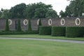 Walled garden with statues and topiary Royalty Free Stock Photo