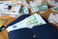 Wallet with different Euro banknotes and credit cards on wooden table, closeup. Money exchange Royalty Free Stock Photo