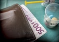 Wallet with dollar next to medicines, concept of copayment health Royalty Free Stock Photo