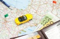 Wallet, Pen And Yellow Car On Map Of Europe