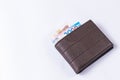 Leather wallet purse with money on white background Royalty Free Stock Photo