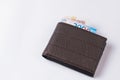 Leather wallet purse with money on white background Royalty Free Stock Photo