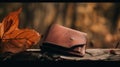 A wallet sitting on top of a wooden table next to a leaf. AI generative image.