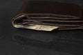 Wallet with twenty pound notes on a table Royalty Free Stock Photo