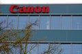 Canon headquarters in Switzerland with a logo on the facade of a corporate building.