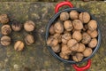 Wallnuts in a red metal bowl