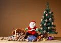 Wallnuts in a wicker basket with a pine tree and santa