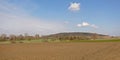 Wallonian farm landscape, with spoil tip of old coalmines Royalty Free Stock Photo