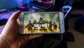 The wallpaper of Call of Duty Mobile version game on a smartphone Royalty Free Stock Photo