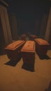 Heavy coffins lie on sand floor in an very small old dusty cemetery crypt in a cave