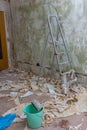 Wallpaper removal with lots of paperon the floor Royalty Free Stock Photo