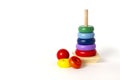 Toy pyramid, wooden, multi - colored rings, on a white background