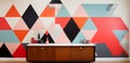 A wallpapered wall with a geometric colorful pattern