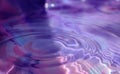 Wallpapers. Frozen movement of water. Drops of water falling and splashing. Violet/pink color.