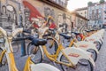 Walls artistics graffitis and bicycles station in Milan, Italy