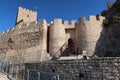 Walls and entrance door of the Almohad castle of Sax on top of a rock. Sax, Alicante, Spain