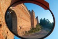 Walls of Gradara, medieval castle-fortress near rimini taken from the outside in a street mirror view