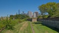 Walls off Fort Jay, Governor`s island, with skyscrapers of Manhattan behind.USA Royalty Free Stock Photo