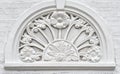 Walls plastered in white with a white floral relief. Royalty Free Stock Photo