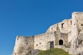 Walls of Spis Castle against clear blue sky in Slovakia.