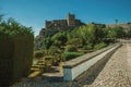 Walls and stone tower of the city Castle over the hill