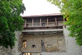 Walls of Tallinn fortress and statue of monk, Estonia. The walls and the many gates are still largely extant today