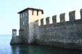 Walls and tower in lake on Castle Castello di Sirmione Royalty Free Stock Photo