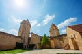 Walls and towers of Blandy-les-Tours castle over blue sky Royalty Free Stock Photo