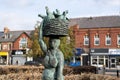 Wallsend's 'Market Woman' by Hans Schwarz, a bronze sculpture of a Roman woman with a basket of hens Royalty Free Stock Photo