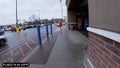 Walmart exterior entrance rainy day side view