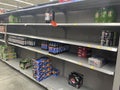 Walmart grocery store interior empty soda shelves