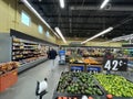 Walmart grocery store interior limes display and people