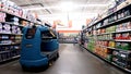 Walmart interior automatic floor scrubber on drink aisle