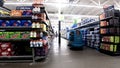 Walmart interior automatic floor scrubber on water aisle