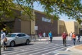 Walmart line outside the store with masked people practicing social distancing 6 feet apart during Covid-19 Corona Virus Pandemic