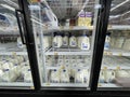 Walmart retail store milk section and prices glass door