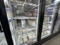 Walmart retail store milk section and prices look through glass door