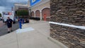 Walmart store exterior sidewalk and fancy stone wall