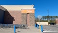 Walmart supercenter exterior clear blue sky pick up orange sign