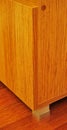 Walnut cabinet and corner detail on mahogany parquet in luxury house