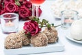 Walnut-chocolate cakes, flowers and rose wine