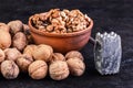 Walnut with clay bowl and iron hammer Royalty Free Stock Photo