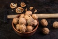 Walnut with hammer against the background of concrete Royalty Free Stock Photo