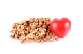 Walnut and hazelnut with heart shape isolated on white Royalty Free Stock Photo