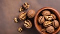 Walnut kernel halves, in a wooden bowl. Close-up, from above on colored background. Healthy eating Walnut concept. Super foods