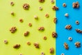 Walnut kernel pattern backdrop. One open nut shell with kernel on yellow blue background. Top view.Flat lay composition Royalty Free Stock Photo