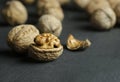 Walnut kernel with shell on wooden backdrop. healthy food for brain. walnut background Royalty Free Stock Photo