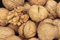 Walnut kernel on whole nuts. Close up Royalty Free Stock Photo