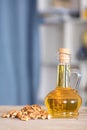 Walnut kernels and a bottle of walnut oil Royalty Free Stock Photo